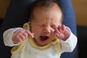 newborn baby stretching and yawning