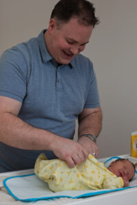 dad with newborn baby