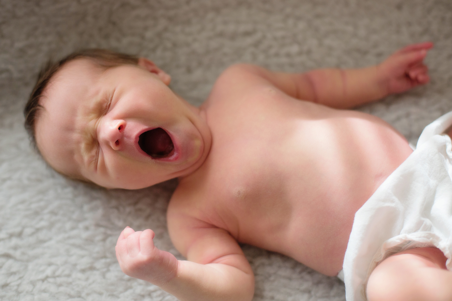 baby yawning at home newborn session