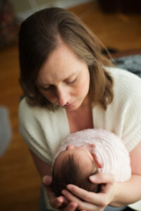 mom gazing at newborn baby