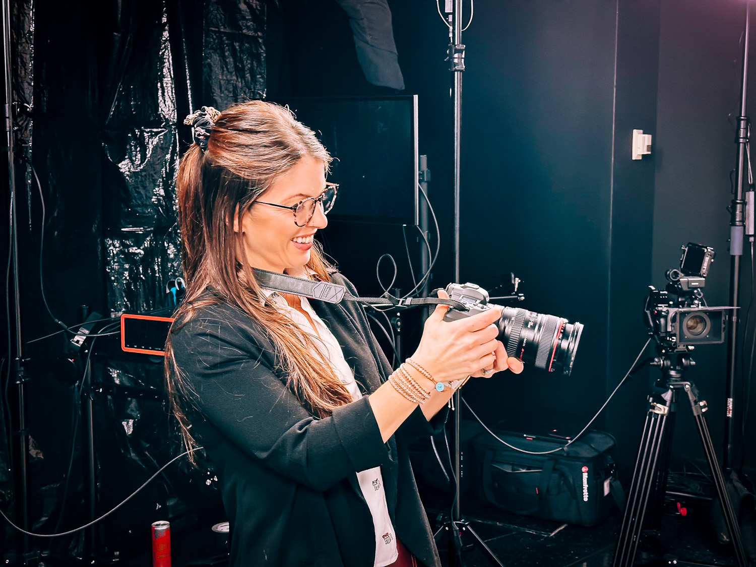 photographer holding camera on television set