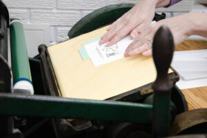 card being printed on a letterpress