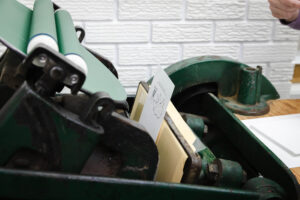 card being printed on a letterpress