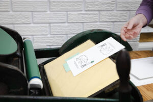 card being printed on a letterpress