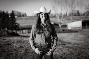 happy cowgirl at golden hour personalized Calgary grad session