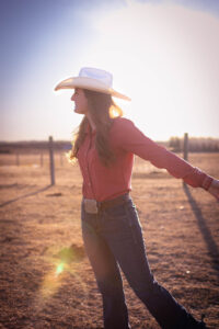 happy cowgirl at golden hour personalized Calgary grad session