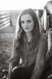 high school graduate portrait on ranch personalized Calgary grad photo shoot black and white