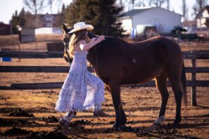 girl running to mount horse bare back personalized Calgary grad photo session