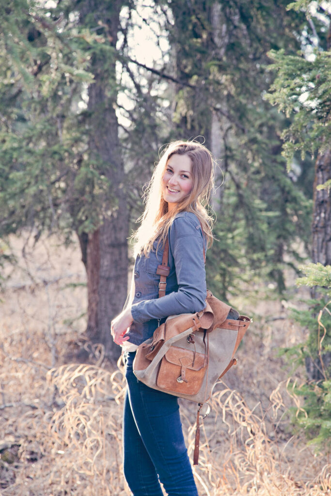 high school graduate posing on path in Griffith Woods Park