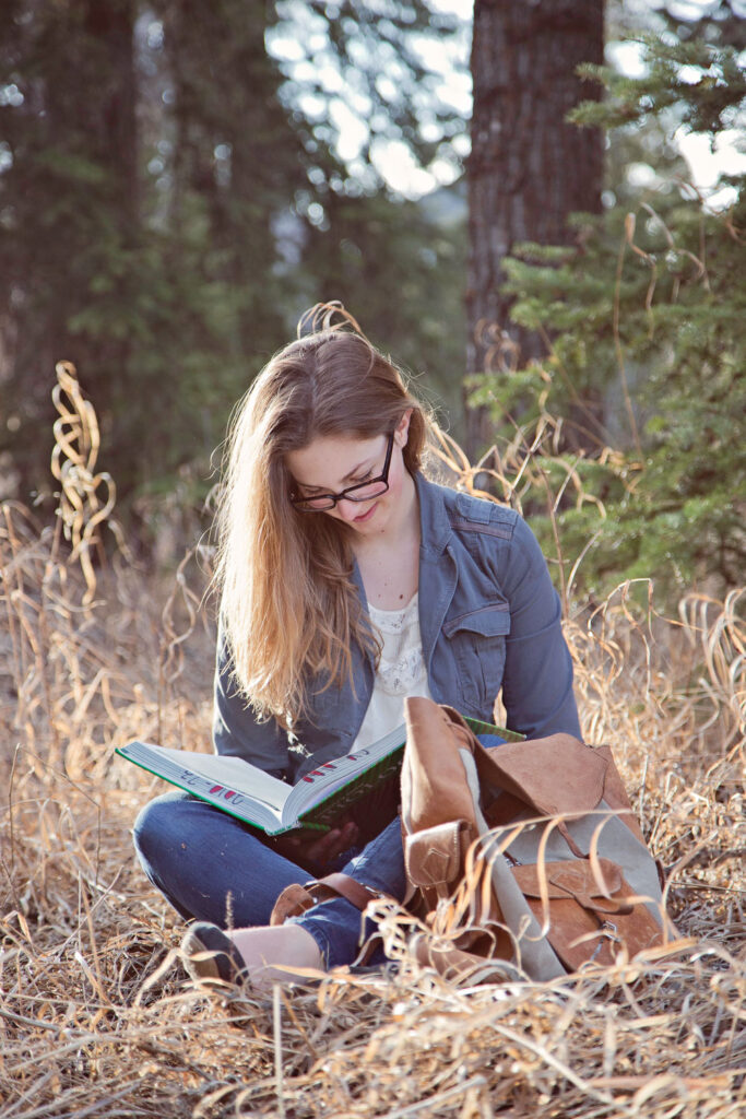 high school graduate studying in Griffith Woods Park on a sunny day