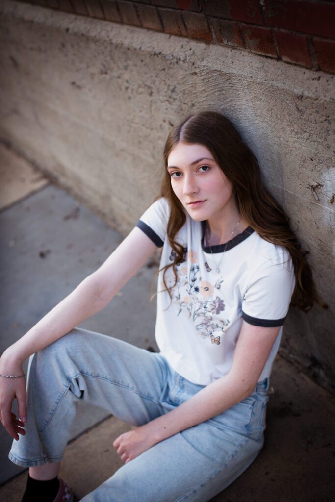 high school graduate informal portrait in urban setting