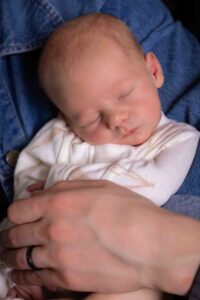 newborn baby in mom's arms