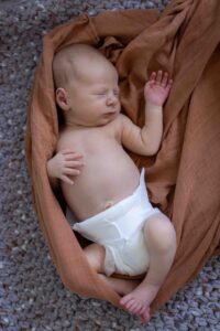 newborn baby in crib