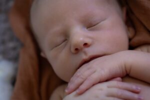 upclose of newborn baby nose at home newborn photography session Calgary