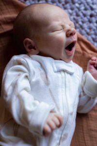 newborn baby yawning at home newborn photography session Calgary
