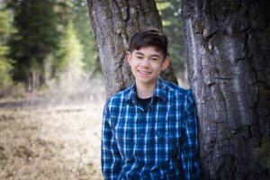 teenage boy posing for picture in Griffith Woods park