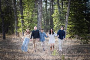 family having fun together in Griffith woods park calgary