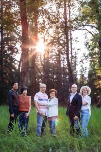 parents, siblings and inlaws posing for family photography calgary family photo session