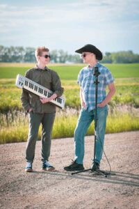 high school musicians on a dirt road calgary personalized grad photoshoot