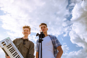two high school musicians posing for photoshoot