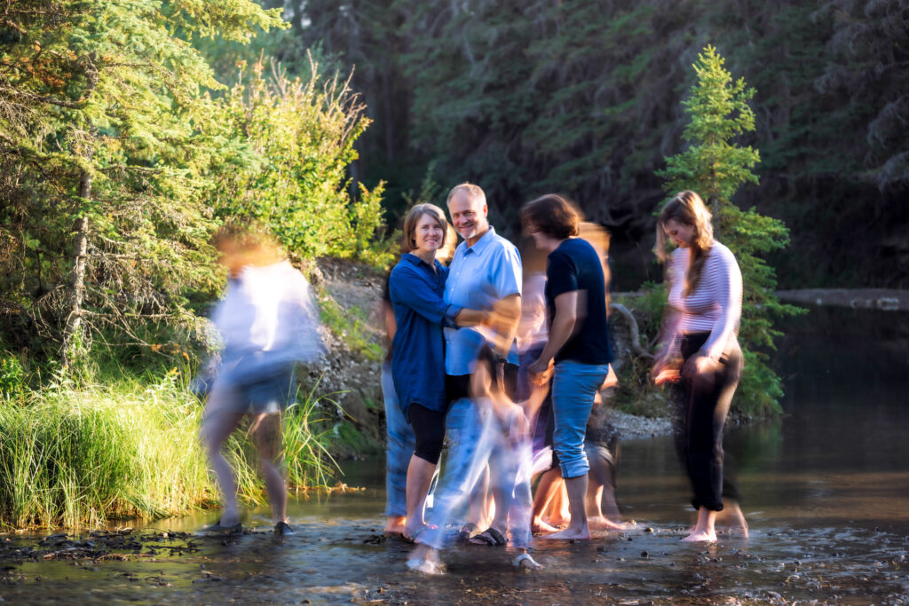 family portrait using motion blur Griffith Woods Calgary family photographer