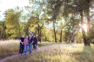 family of five posing for photos at Fish Creek Park Calgary Alberta