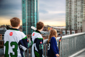 Calgary family photos with Scotiabank Saddledome skyline
