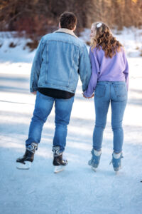 couple Gliding across the ice together