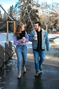 Couple enjoying hot chocolate at Bowness Park café