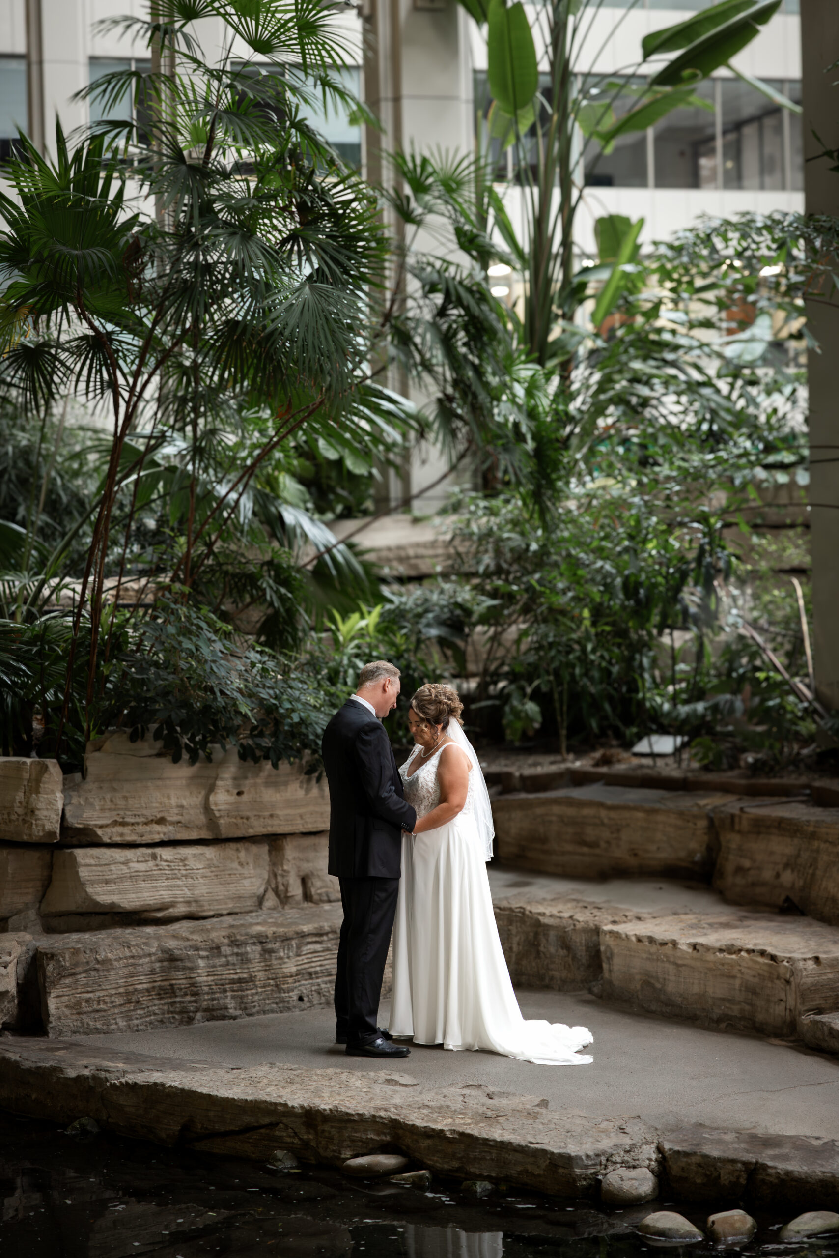 Indoor bridal portrait capturing moody shadows and cinematic light at Calgary wedding
